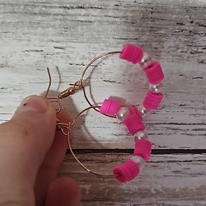 Play beat earrings with pink and pearls.